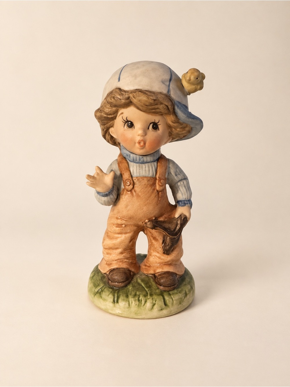 Hand-Painted Ceramic Boy Figurine in Blue and Tan